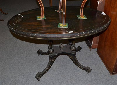 Lot 407 - A Victorian ebonised loo table