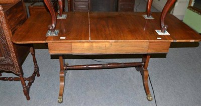 Lot 414 - Regency rosewood sofa table with paw capped feet