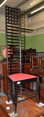 Lot 420 - A Hill House 1 style black stained ash wood ladder back chair, with red seat, 140cm