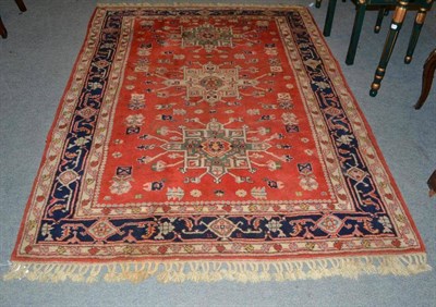 Lot 421 - Heriz design rug, North East Anatolia, the blood red field with three medallions enclosed by indigo