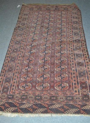 Lot 423 - Tekke rug, Emirate of Bukhara, the field with three columns of quartered guls enclosed by...