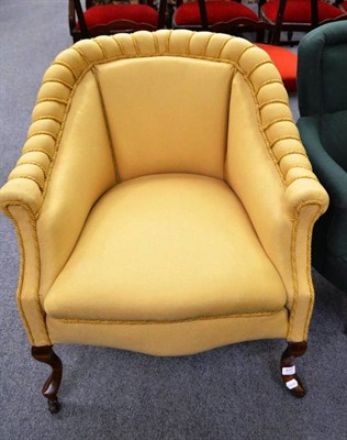 Lot 437 - A Victorian easy chair upholstered in gold fabric on cabriole front legs