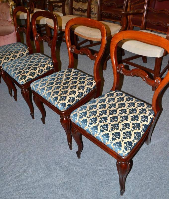 Lot 449 - A set of four Victorian mahogany balloon back chairs on cabriole legs