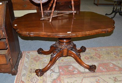 Lot 450 - Victorian oval loo table with carved base and shaped top