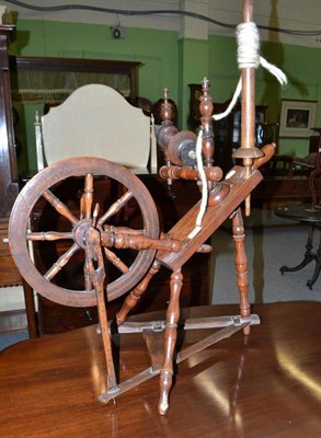 Lot 451 - Fruitwood spinning wheel