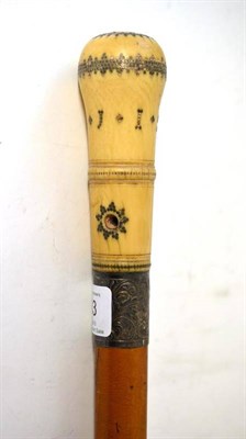 Lot 253 - An Ivory and Pique Walking Cane, dated 1701, with later ferrule, and on a Malacca shaft, the handle