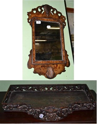 Lot 484 - An 18th century style carved wooden pier glass, the rear carved with a coat of arms the initials 'A