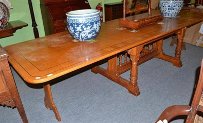 Lot 492 - A blonde oak extending dining table