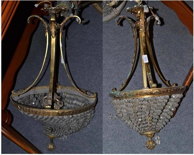 Lot 554 - Two gilt metal basket lights