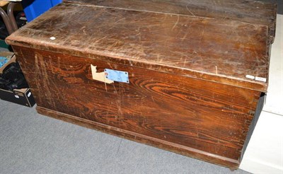 Lot 573 - A wide vintage pine trunk with hinged lid