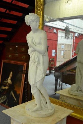 Lot 263 - After the Antique: A Carrara Marble Figure of a Maiden, standing full length in loose toga, her...