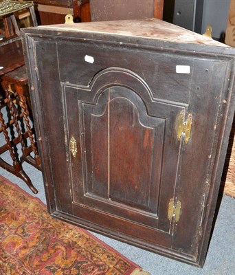 Lot 615 - An oak corner cupboard