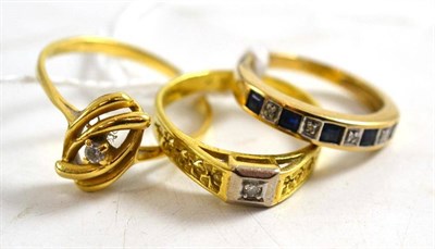 Lot 13 - An 18ct gold diamond ring, a ring stamped  ";18kt"; and a 9ct gold sapphire and diamond half...