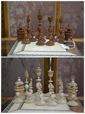 Lot 271 - An Anglo-Indian Carved Sandalwood and Elephant Ivory Chess Set, circa 1820, each with petalette...