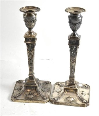 Lot 35 - Pair of Georgian style silver table candlesticks