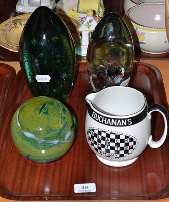 Lot 49 - Three dump paperweights and a Buchanan's black and white whisky jug