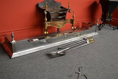 Lot 274 - An Edwardian Polished Steel Neo-Classical Revival Fire Fender, with broad and dipped top rail...