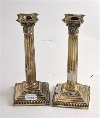 Lot 68 - A pair of Edwardian silver Corinthian column candlesticks, Sheffield 1901