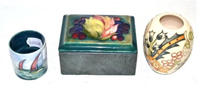 Lot 84 - Moorcroft ship vase, another Moorcroft vase and a Moorcroft leaf and berry cover on a slate base