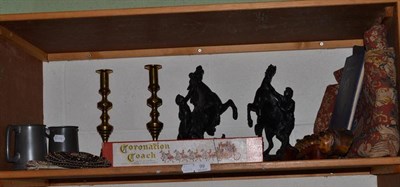 Lot 99 - A shelf including a pair of brass candlesticks, pair of spelter Marley horses, a Lesney...