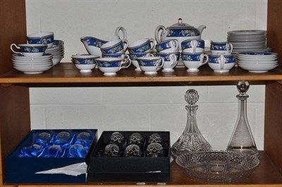 Lot 100 - A Wedgwood dinner service and two sets of crystal wine glasses, etc (on two shelves)