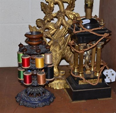 Lot 104 - Sewing bobbin, eagle wall sconce and a gilt figural lamp