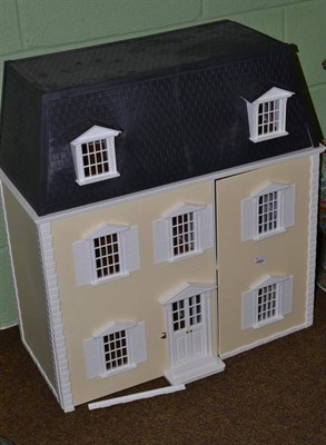 Lot 115 - Modern cream dolls house, front opening, fully furnished together with a box of assorted dolls...