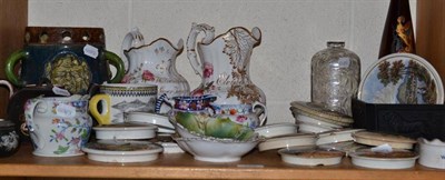 Lot 122 - Shelf of ceramics including commemorative jugs, Prattware lids and a tyg