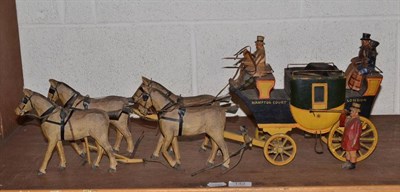 Lot 142 - A late Victorian carved and painted wood coach and horses with coachman and passengers