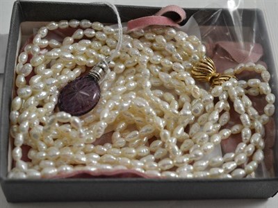 Lot 152 - A freshwater pearl necklace, earrings and an amethyst glass scent bottle