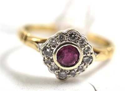 Lot 156 - A 9ct gold ruby and diamond cluster ring