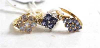 Lot 157 - A 9ct white gold tanzanite ring, a 9ct gold tanzanite cluster ring and a 9ct gold moonstone...