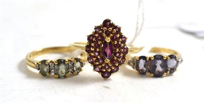 Lot 158 - A 9ct gold iolite ring, a 9ct gold green stone ring (possibly sapphires) and a 9ct gold pink...