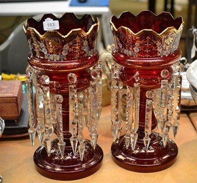 Lot 183 - A pair of Victorian enamelled ruby glass lustres