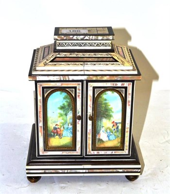 Lot 186 - Mother-of-pearl and bone inlaid table top cabinet with two doors enclosing a series of drawers