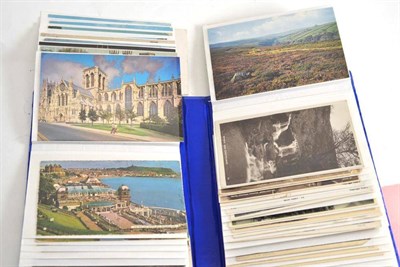 Lot 234 - A photograph album containing a collection of postcards relating to Yorkshire, including...