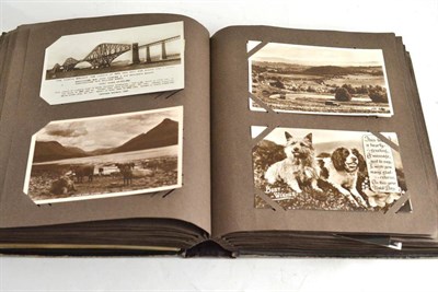 Lot 235 - A postcard album containing approximately two hundred postcards, subjects including topography...