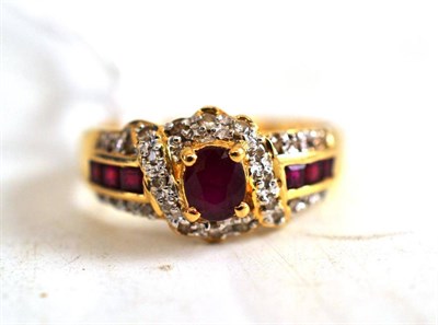 Lot 251 - A ruby and diamond cluster ring, stamped ";585"; and ";14K"