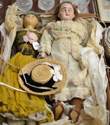 Lot 279 - Wax over shoulder head doll on fabric body, wearing a yellow dress and a bisque shoulder head...