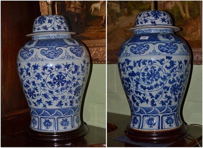 Lot 284 - A very large pair of Chinese blue and white baluster vases and covers converted to lamps, on...