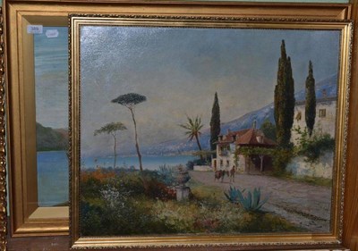 Lot 389 - A.L. Teni, Figure and a donkey on a path in an Italian lakeland landscape, signed, oil on...