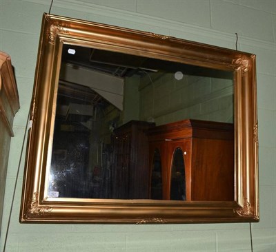 Lot 421 - A large gilt framed wall mirror