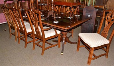 Lot 449 - Reproduction dining table, two leaves and eight dining chairs