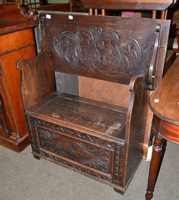 Lot 461 - Carved oak hall bench