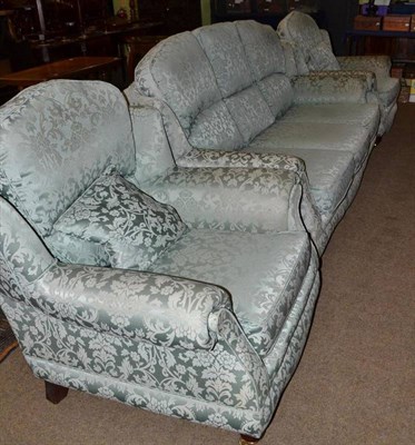 Lot 468 - A green green upholstered three piece suite comprising three seater settee and pair of...