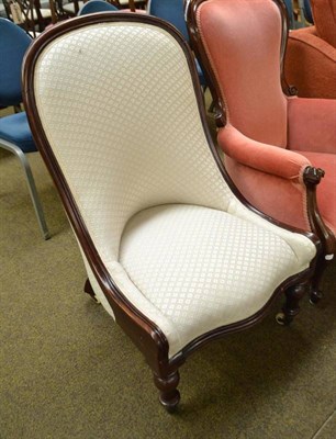 Lot 475 - Victorian mahogany framed easy chair with cream upholstery