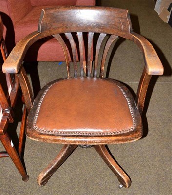 Lot 476 - 1920s oak swivel office chair