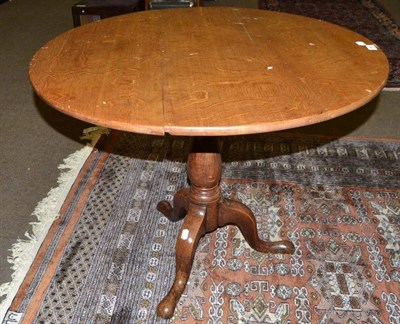 Lot 483 - George III blonde oak tripod table