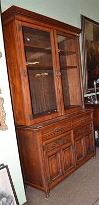 Lot 490 - Late Victorian Maple & Co mahogany bookcase, with brass furniture, a glazed cabinet top over...