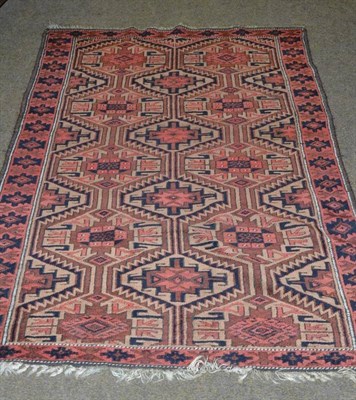 Lot 496 - Belouch rug, Persian/Afghan frontier, the honeycomb lattice field with a column of Memling guls...